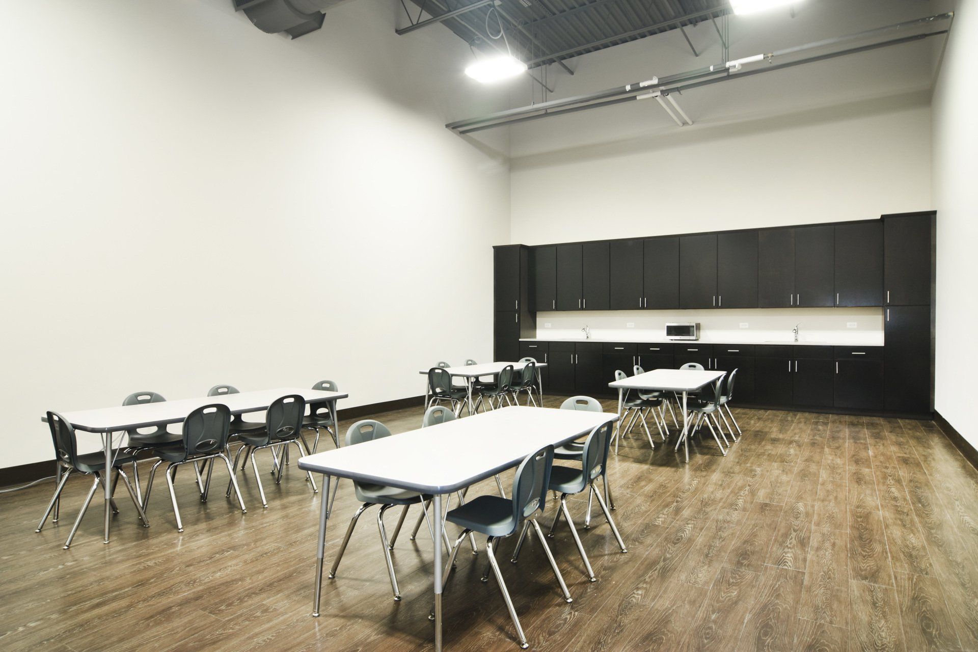 A large room with tables and chairs in it