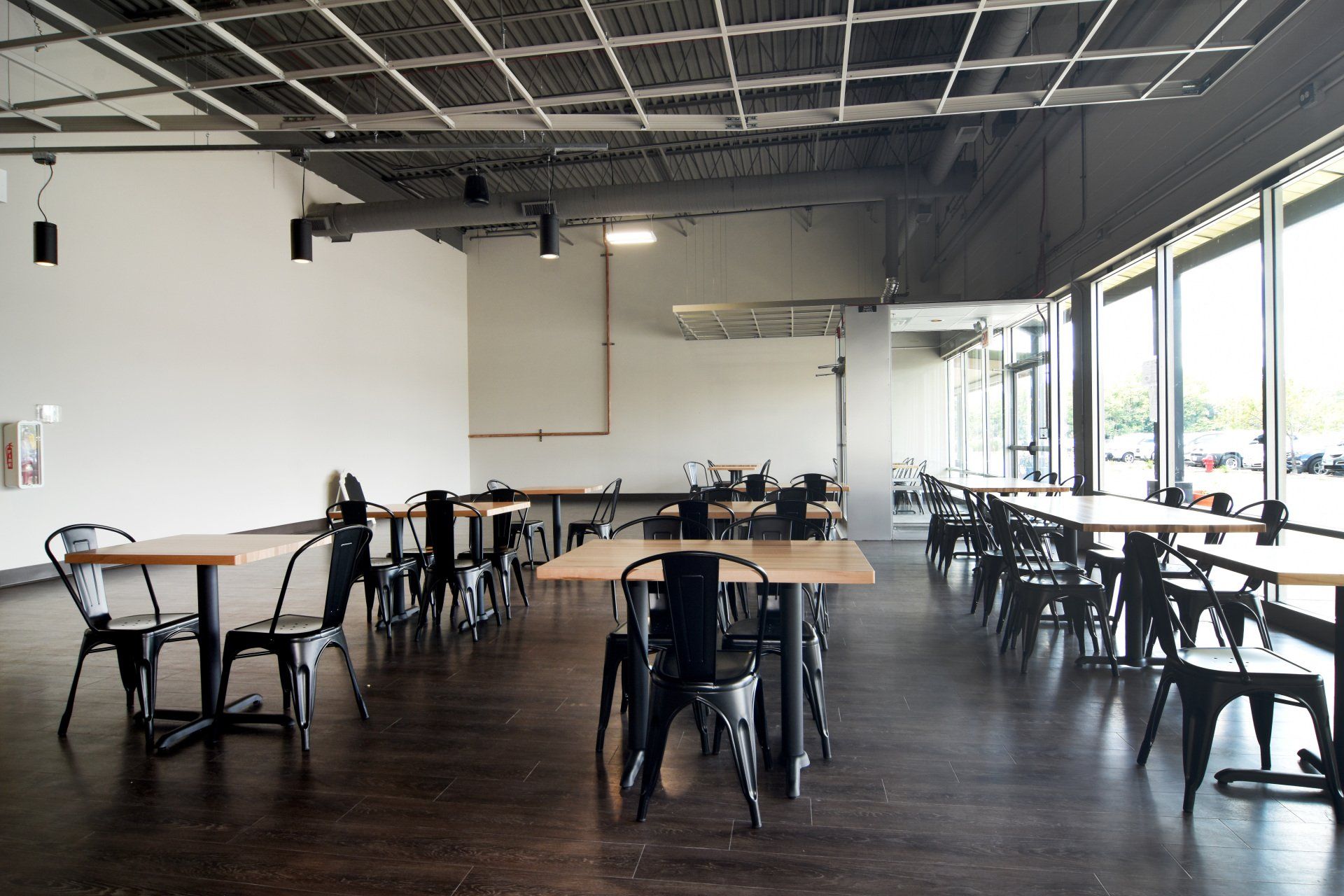 A large room with tables and chairs in it