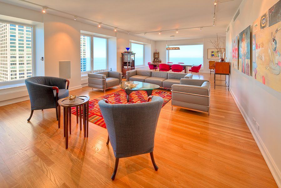 A living room with a lot of furniture and a large window