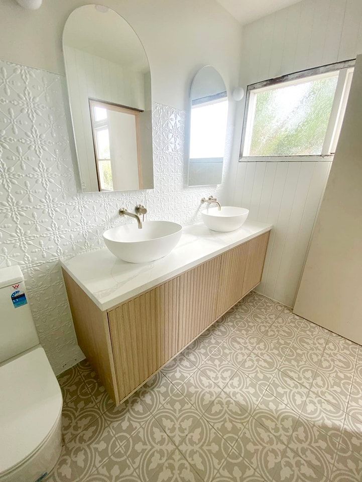A Bathroom with Two Sinks , a Toilet , and Two Mirrors — VG Cabinets In Warrnambool, VIC