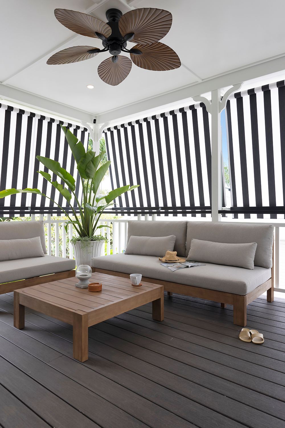 Outdoor Patio with Seating, Black and White Striped Shades, and A Ceiling Fan — Wares Blinds, Screens & Awnings In Gladstone Central, QLD