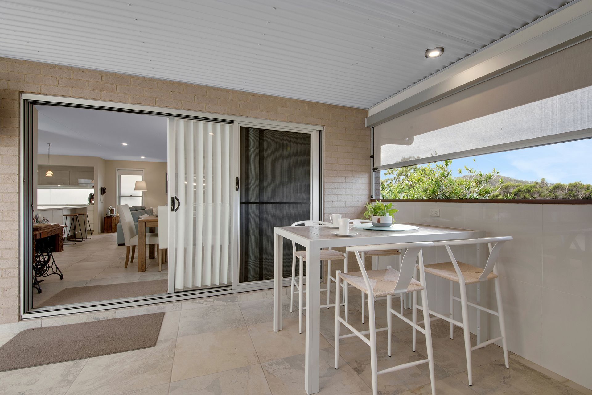 Open White Doorway Leads to A Room with A Pool Table, with A View of A Yard and Pool Outside — Wares Blinds, Screens & Awnings In Gladstone Central, QLD