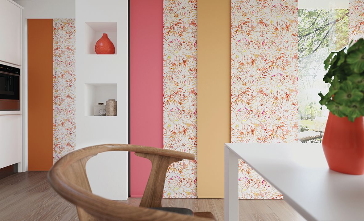 Colorful accent wall with speckled panels, niches, and wooden chair in a kitchen.