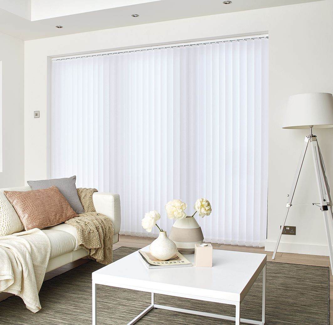 White vertical blinds on a window, next to a closed white door. A/C unit is visible.