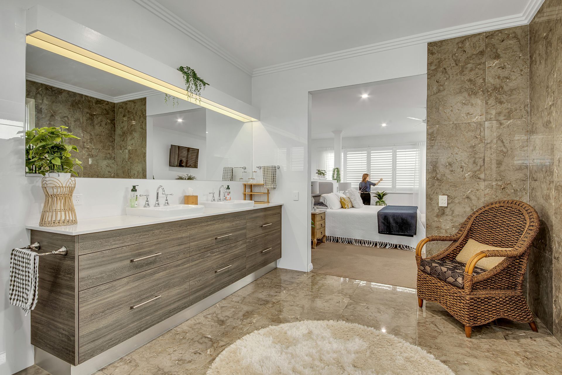 Bathroom With a Vanity and a Bedroom Visible in the Background — Wares Blinds, Screens & Awnings In Gladstone Central, QLD