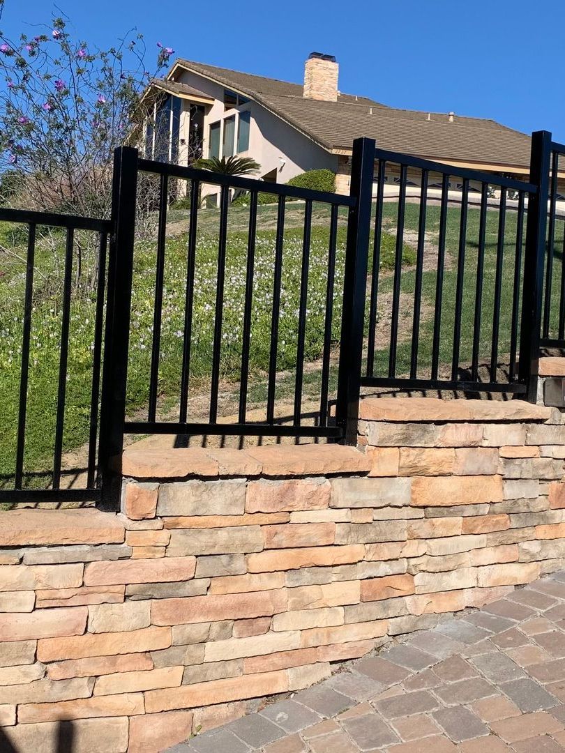 wrought iron fence outside of residential home