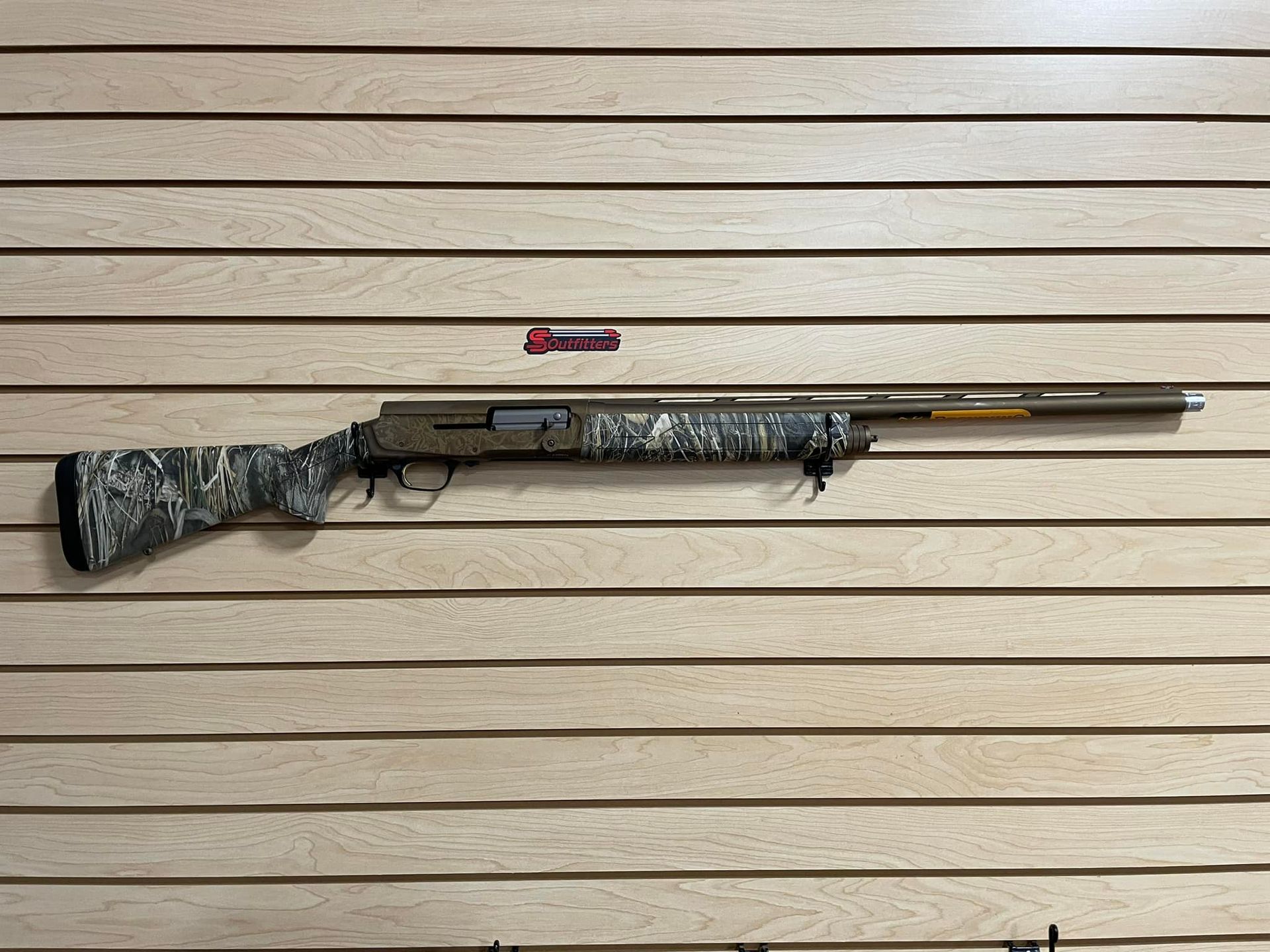 A shotgun hanging on the wall