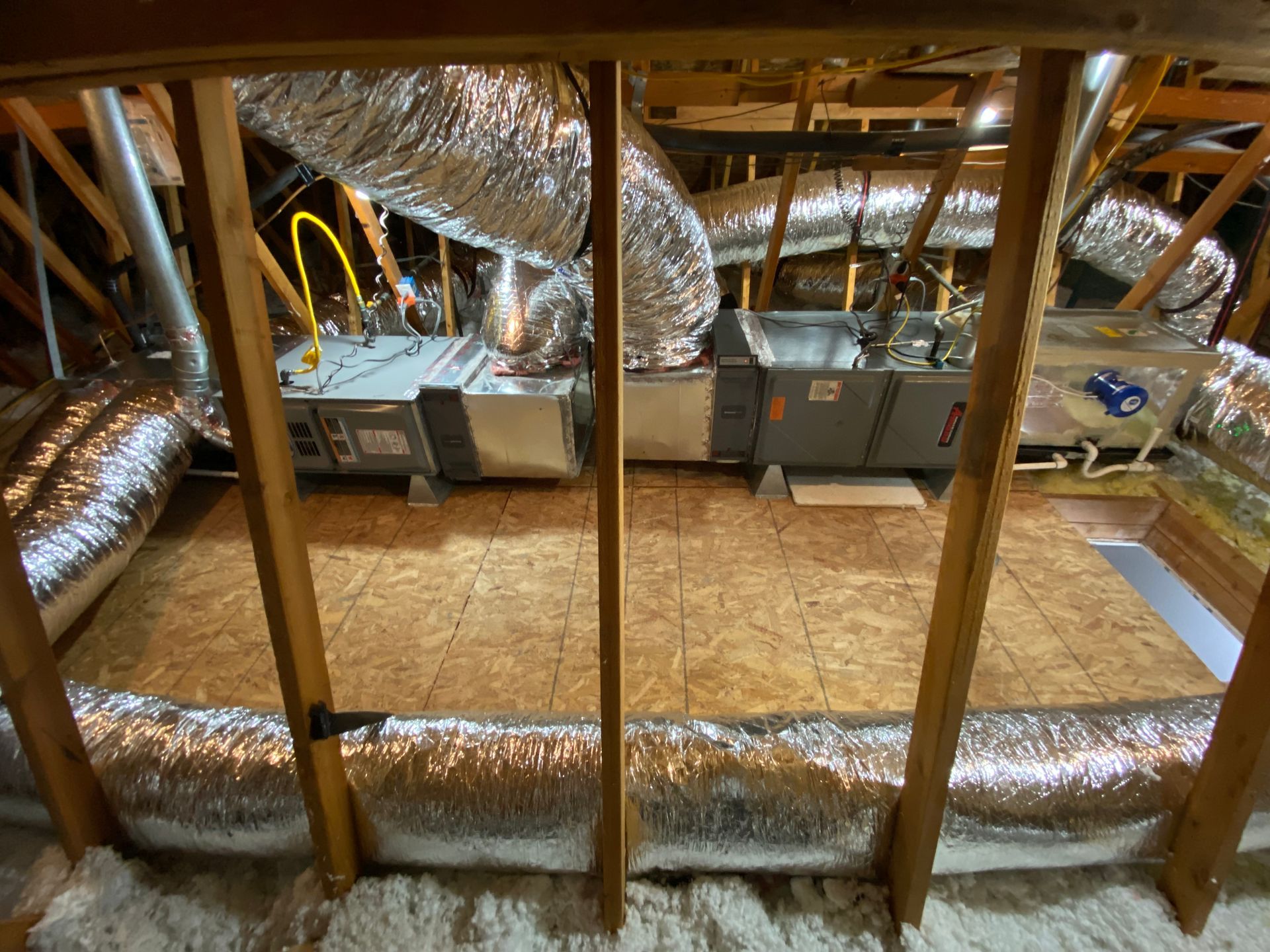 A room with a lot of ducts and pipes in it