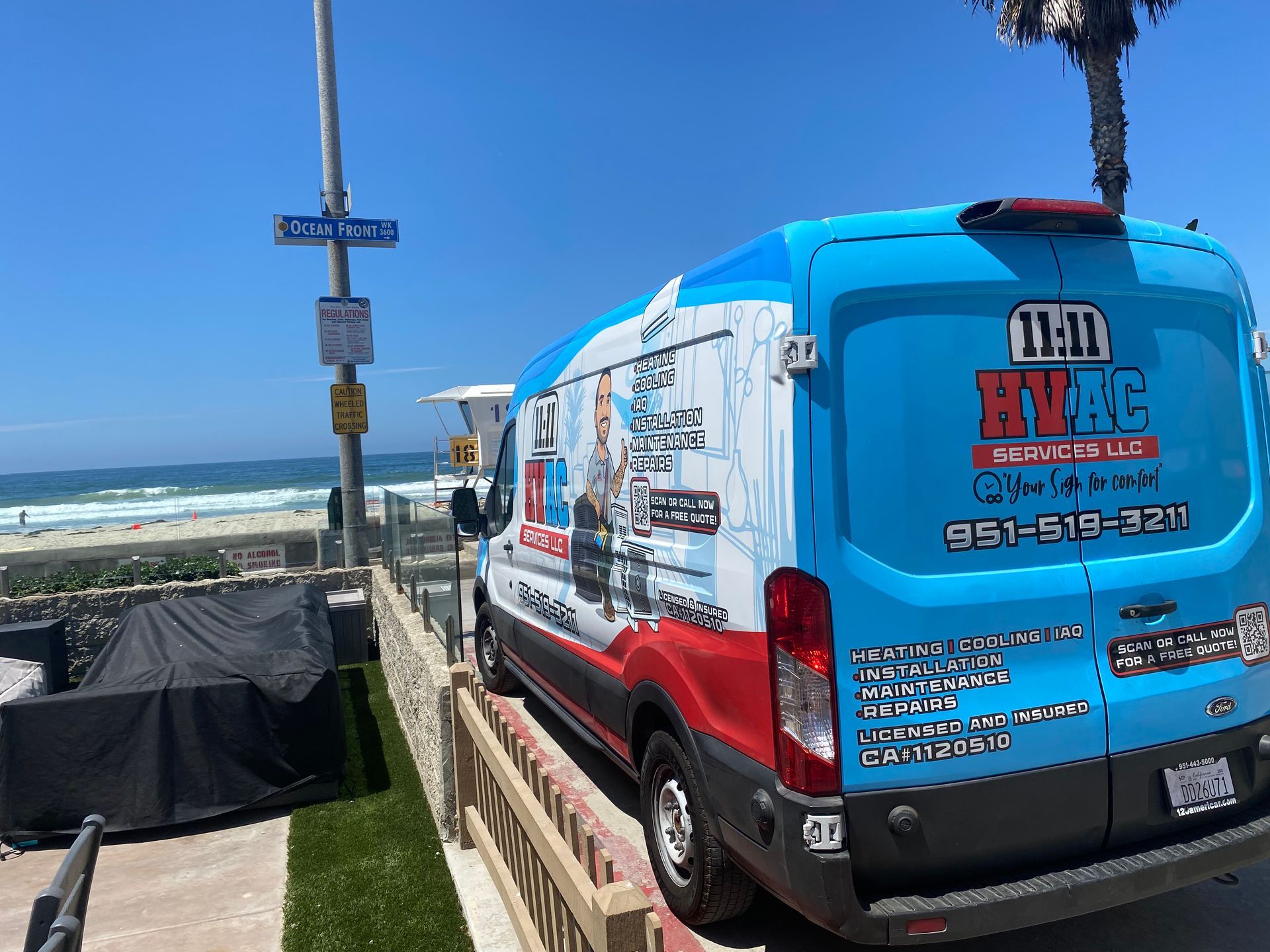 A blue and red van is parked on the side of the road.