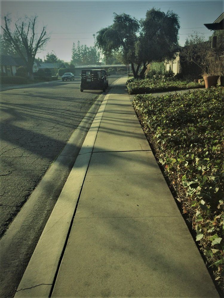 A golf cart is parked on the side of the road