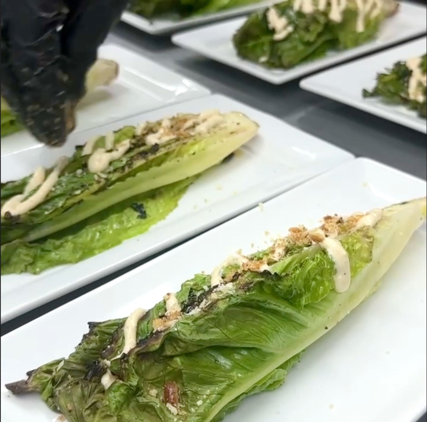 Caesar salad with romaine, shaved parmesan and micro croutons from Venue at the Cove