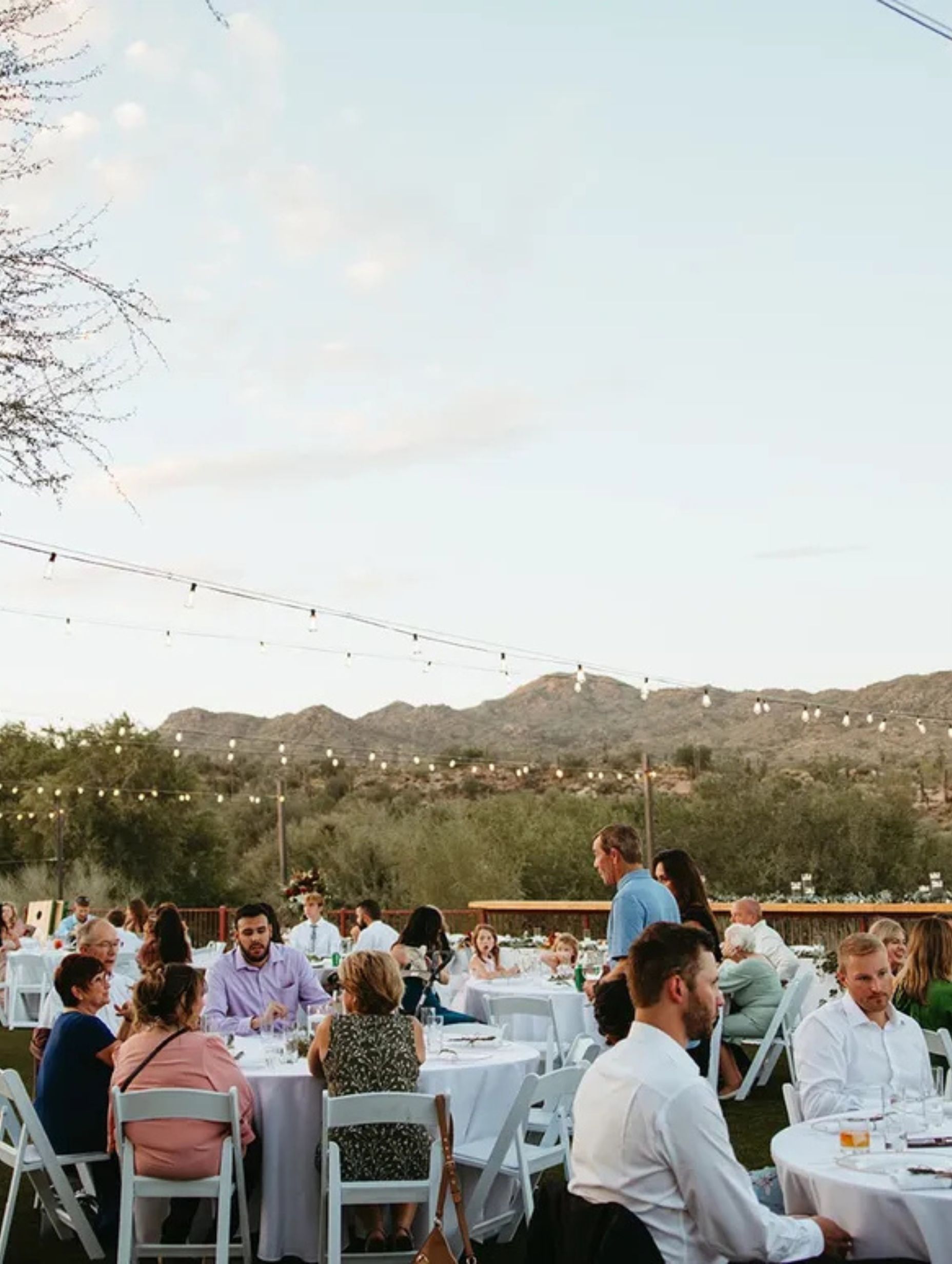 Dinner set up for event at Venue at the Cove towards sunset after wedding ceremony and cocktail hour