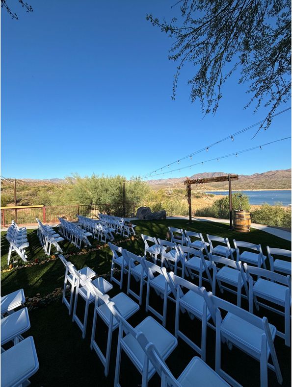 Wedding set up with mountains and Bartlett Lake in the back at Venue at the Cove