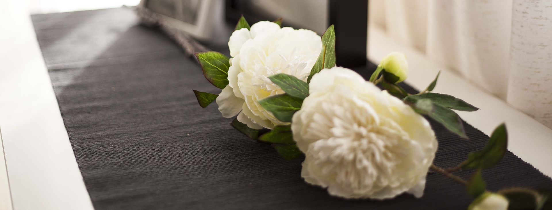 a group of people are carrying a coffin in a church .