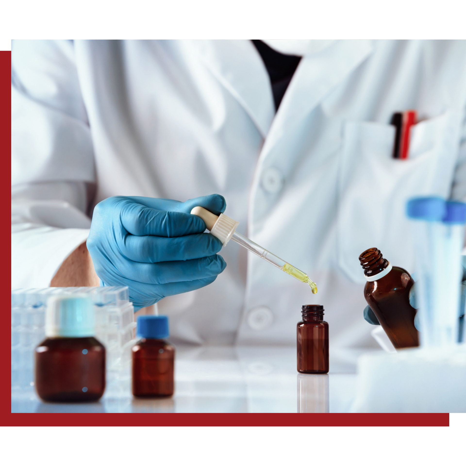 A scientist is using a pipette to pour liquid into a bottle.