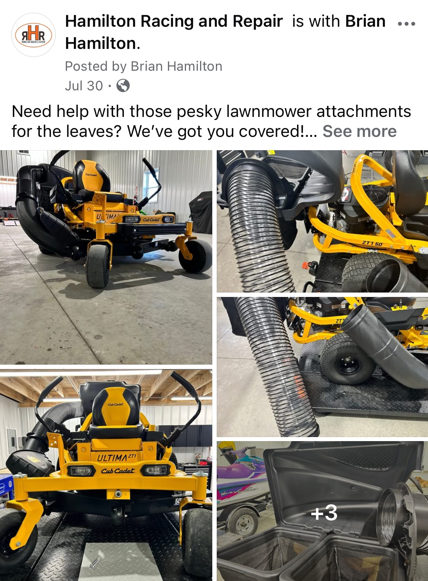 Lawnmower with leaf collection attachments, yellow and black, in a garage. Hamilton Racing and Repair.
