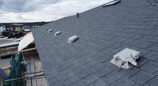 A slate roof with deformed vents.