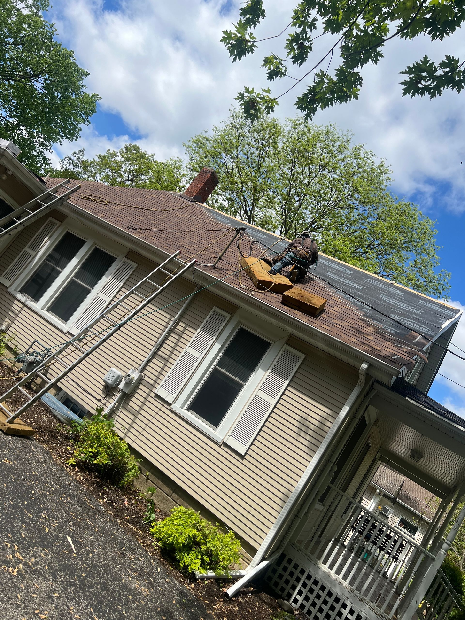 A house with a roof that is being repaired.