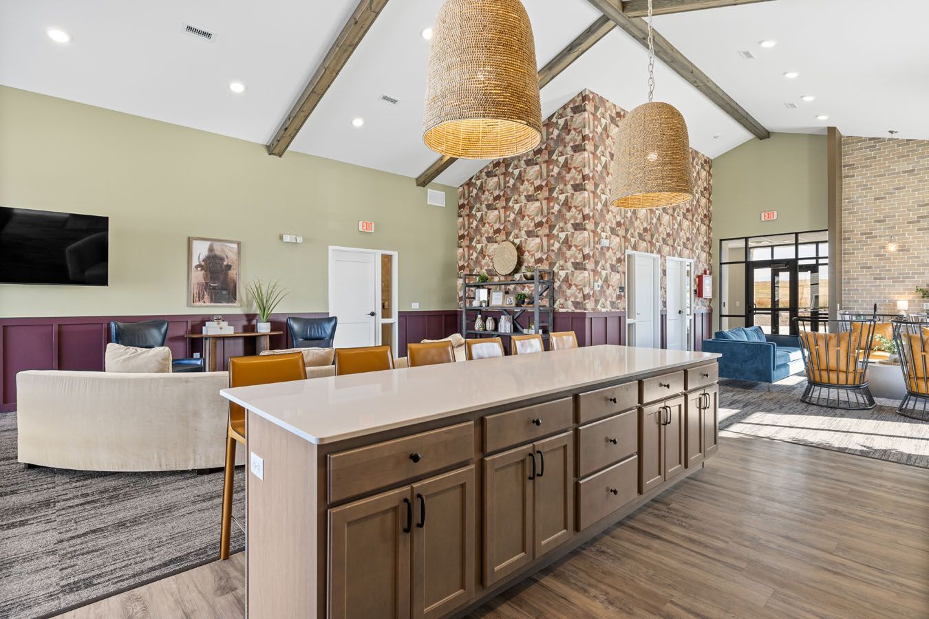 there is a large island in the middle of the room .