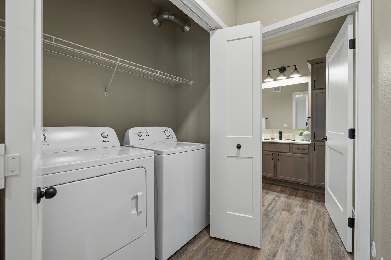 a laundry room with a washer and dryer in a house .
