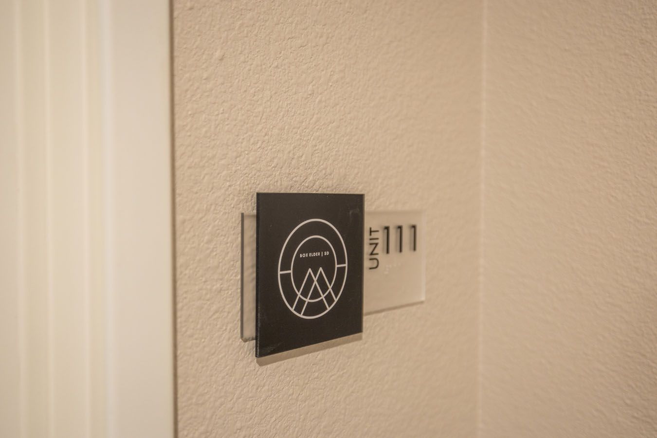 there is a sign on the wall that says room 111 .