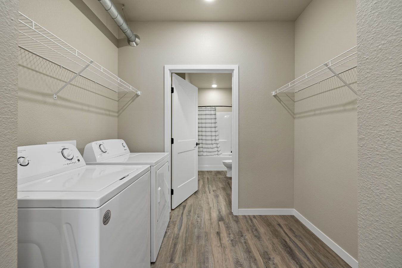 a laundry room with a washer and dryer in it .