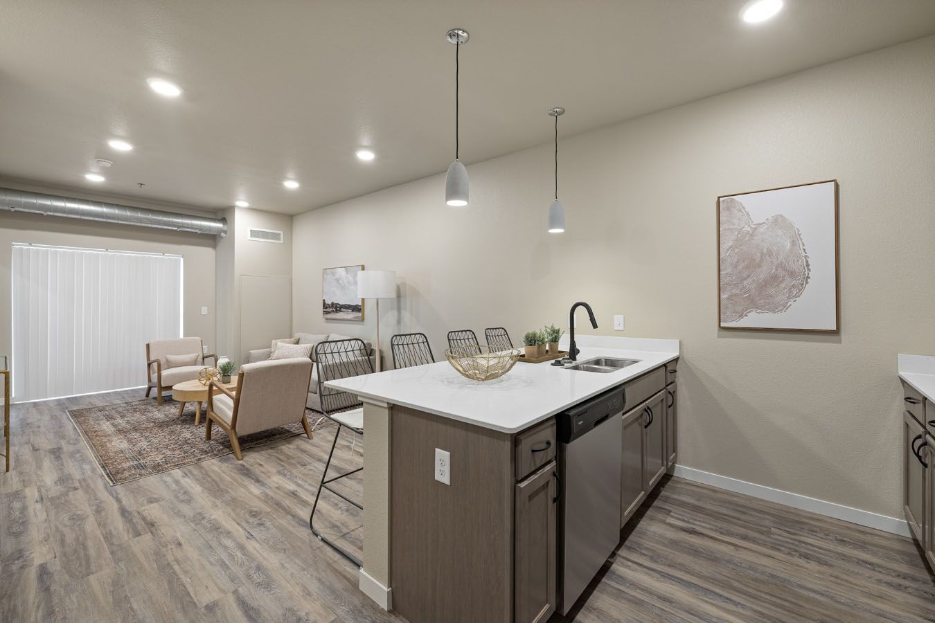 a kitchen with a large island in the middle of the room .