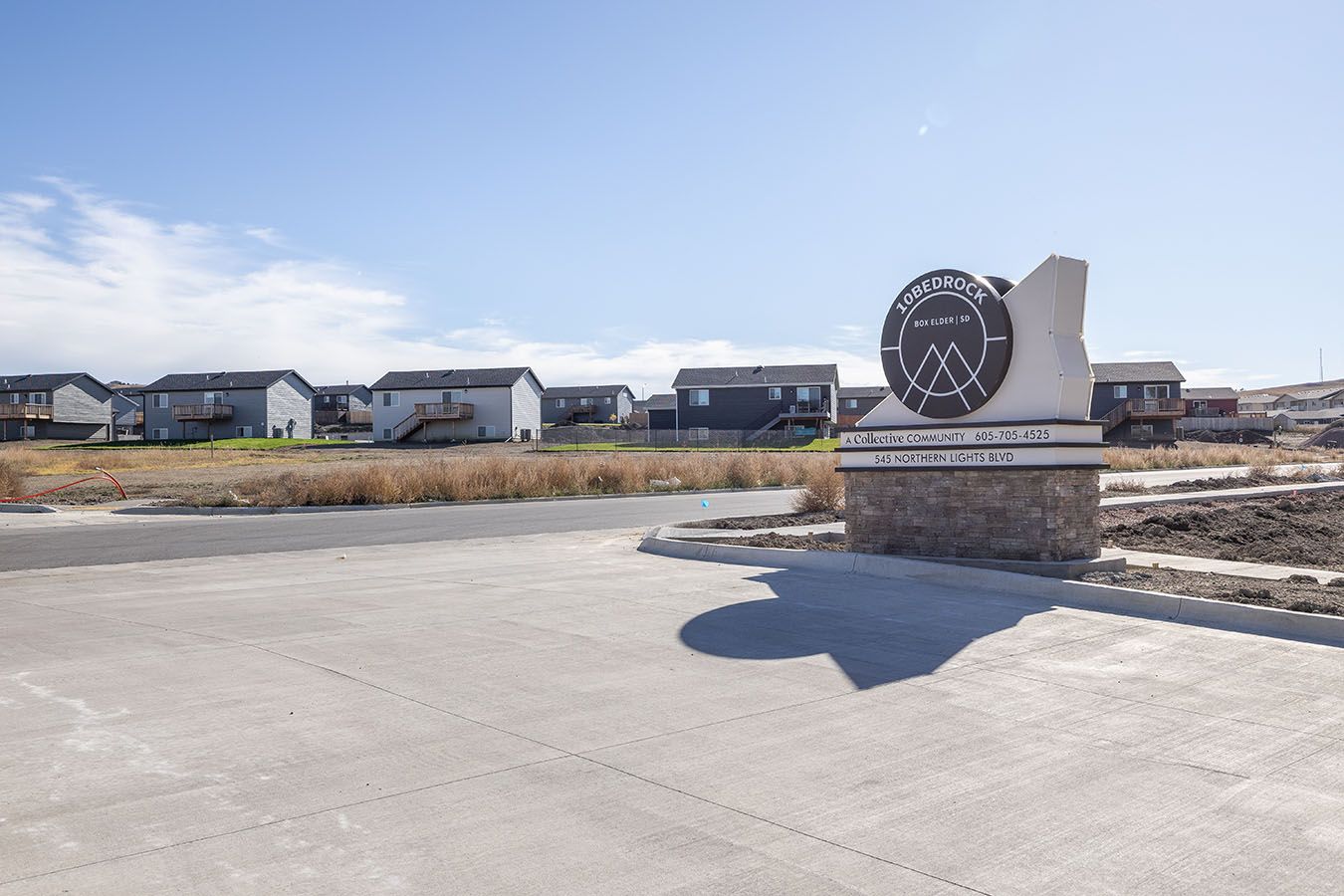 there is a sign in the middle of the road that says welcome .