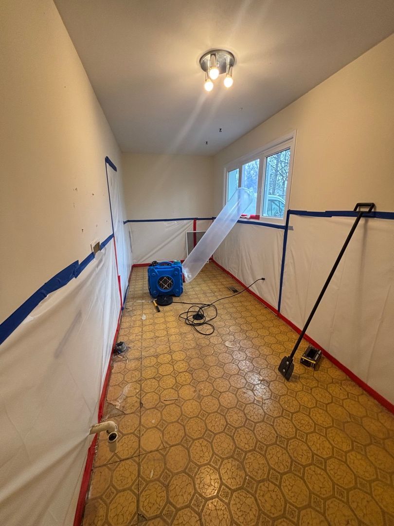 Asbestos removal in progress with full containment protocol in place