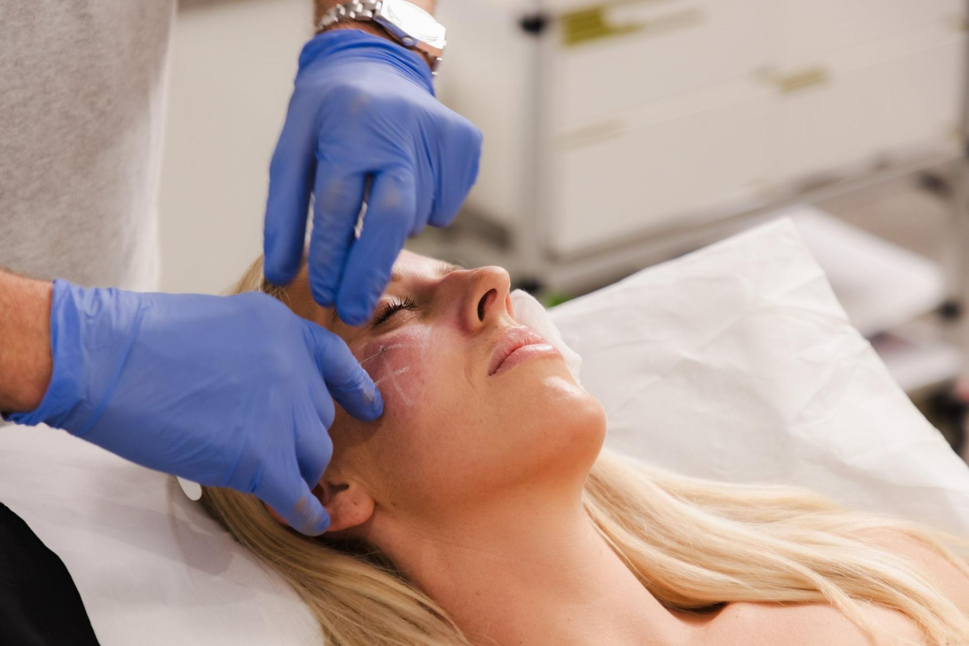 Woman is Getting a Botox Injection in Her Face — Cimed Aesthetics in Newcastle, NSW