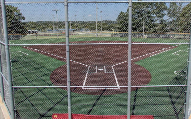 A view of a baseball field through a chain link fence