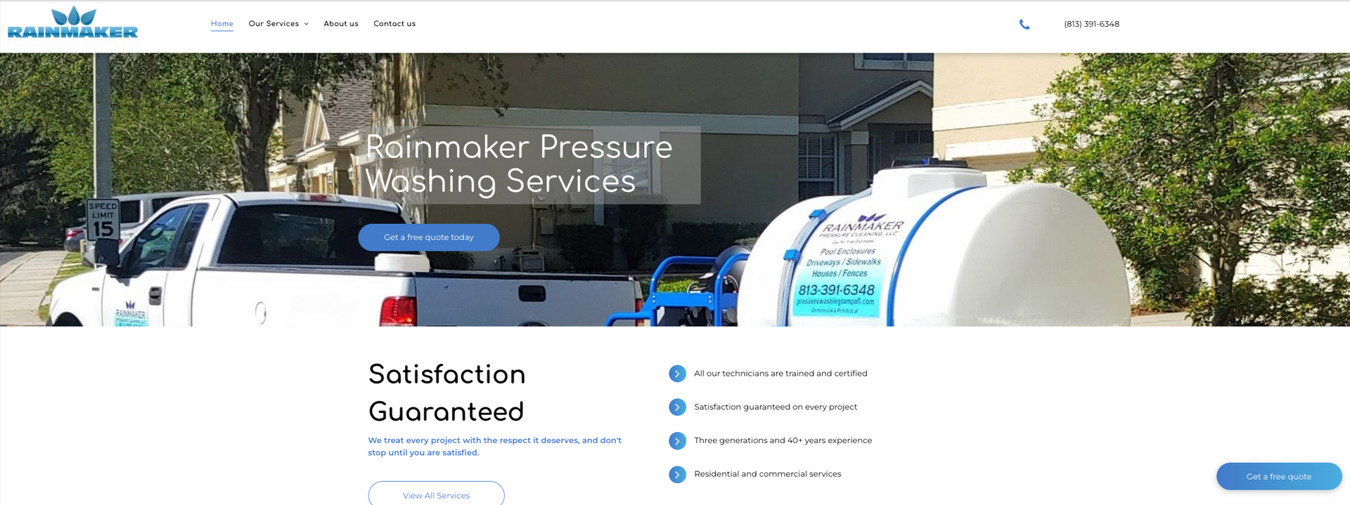 a white truck is parked in front of a building next to a large white tank .