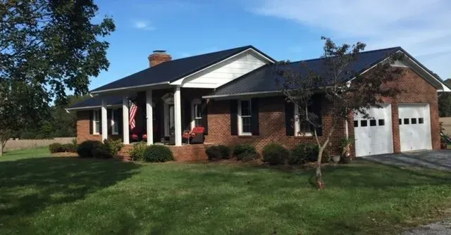 Big House With Blue Roof — Newton, NC — Piedmont Metal Roofing LLC