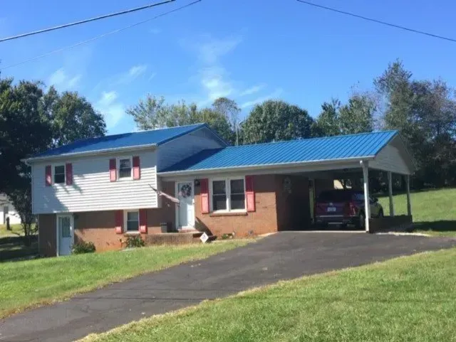 Blue Metal Roof House — Newton, NC — Piedmont Metal Roofing LLC