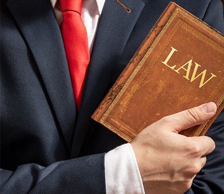 Lawyers — Attorney Holding A Book in Flemington, NJ
