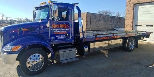 Towing service truck from Sperling’s Garage & Wrecker Service Towing service truck from Sperling’s Garage & Wrecker Service