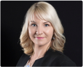 Portrait of a smiling blonde woman against a black background