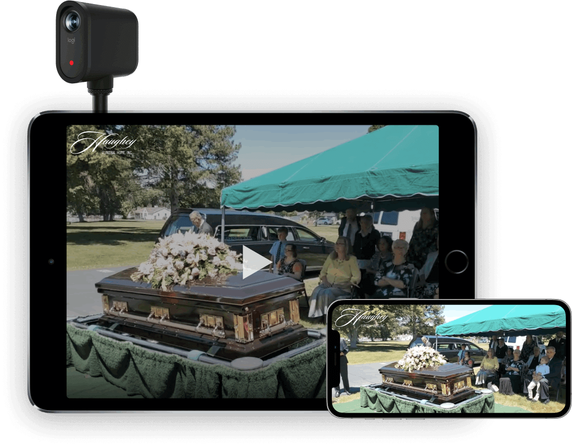 Tablet and phone showing an outdoor buffet under a teal canopy, with food trays on a table.