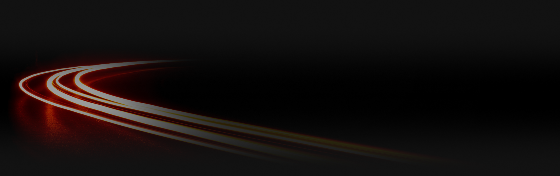 Curved light trails on a black background, with a red glow near the curve. | ECP Auto Service