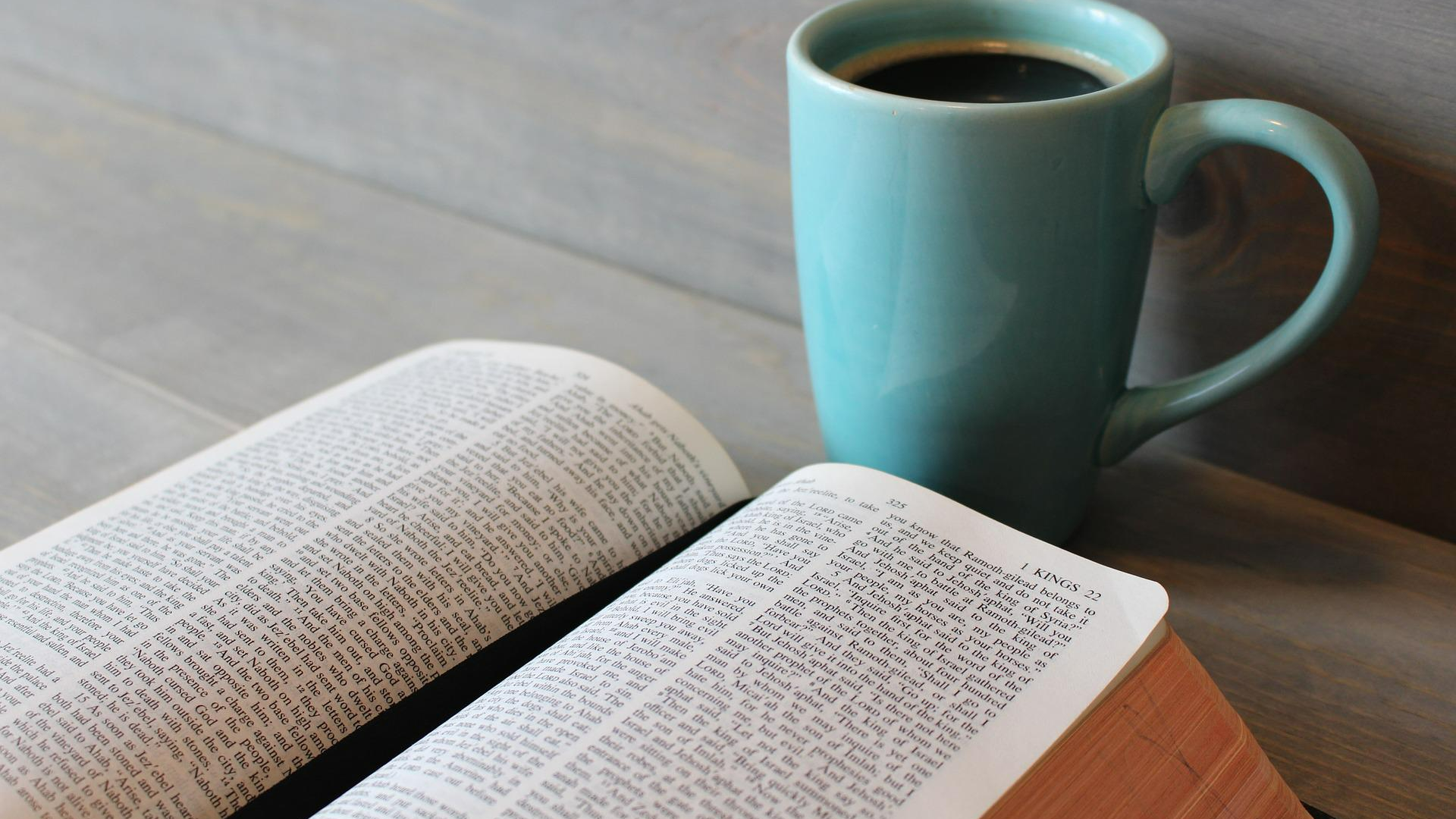 reading the Bible with a cup of coffee