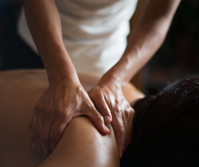 A person is getting a massage on their back.