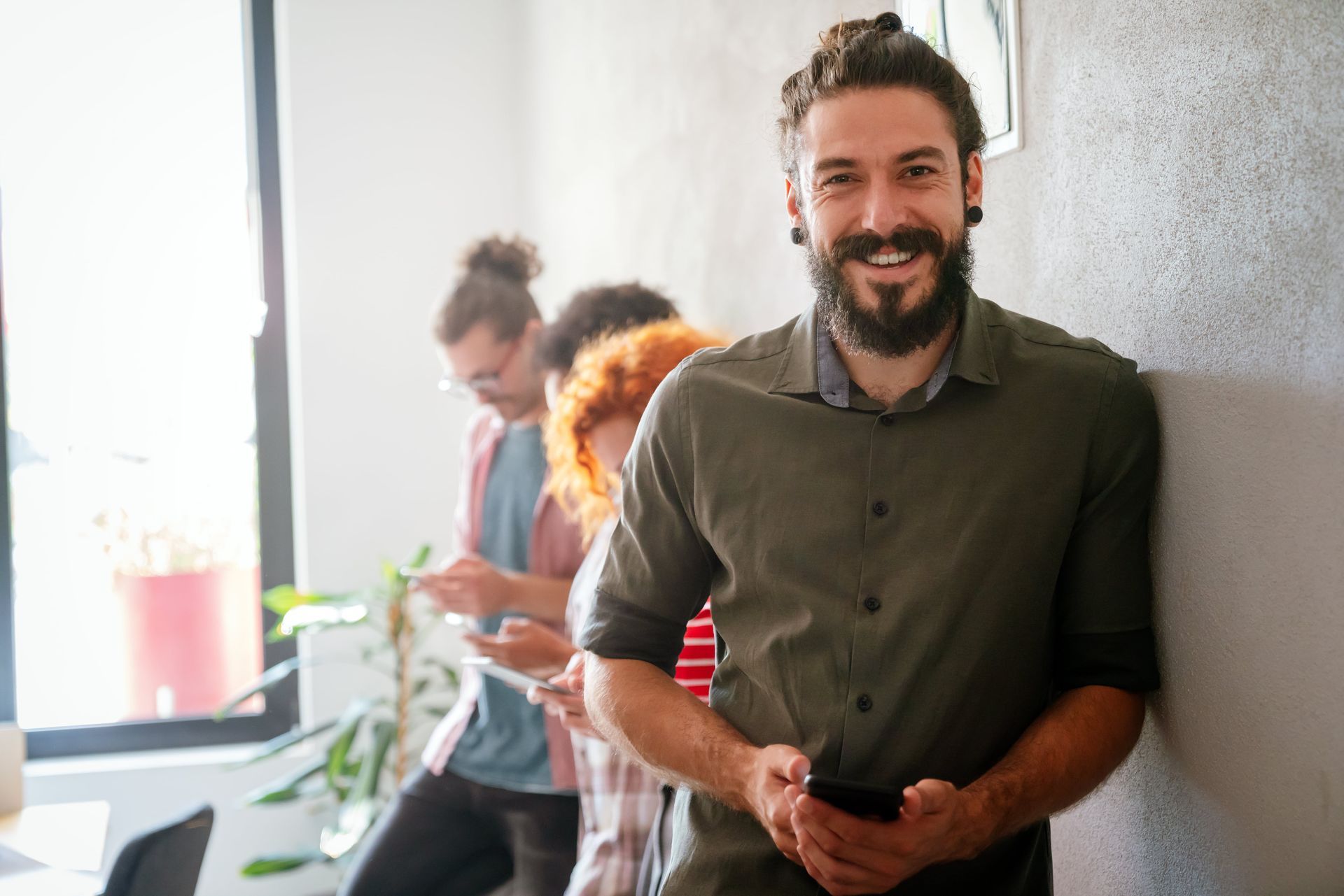 A woman is sitting on a couch with her legs crossed.