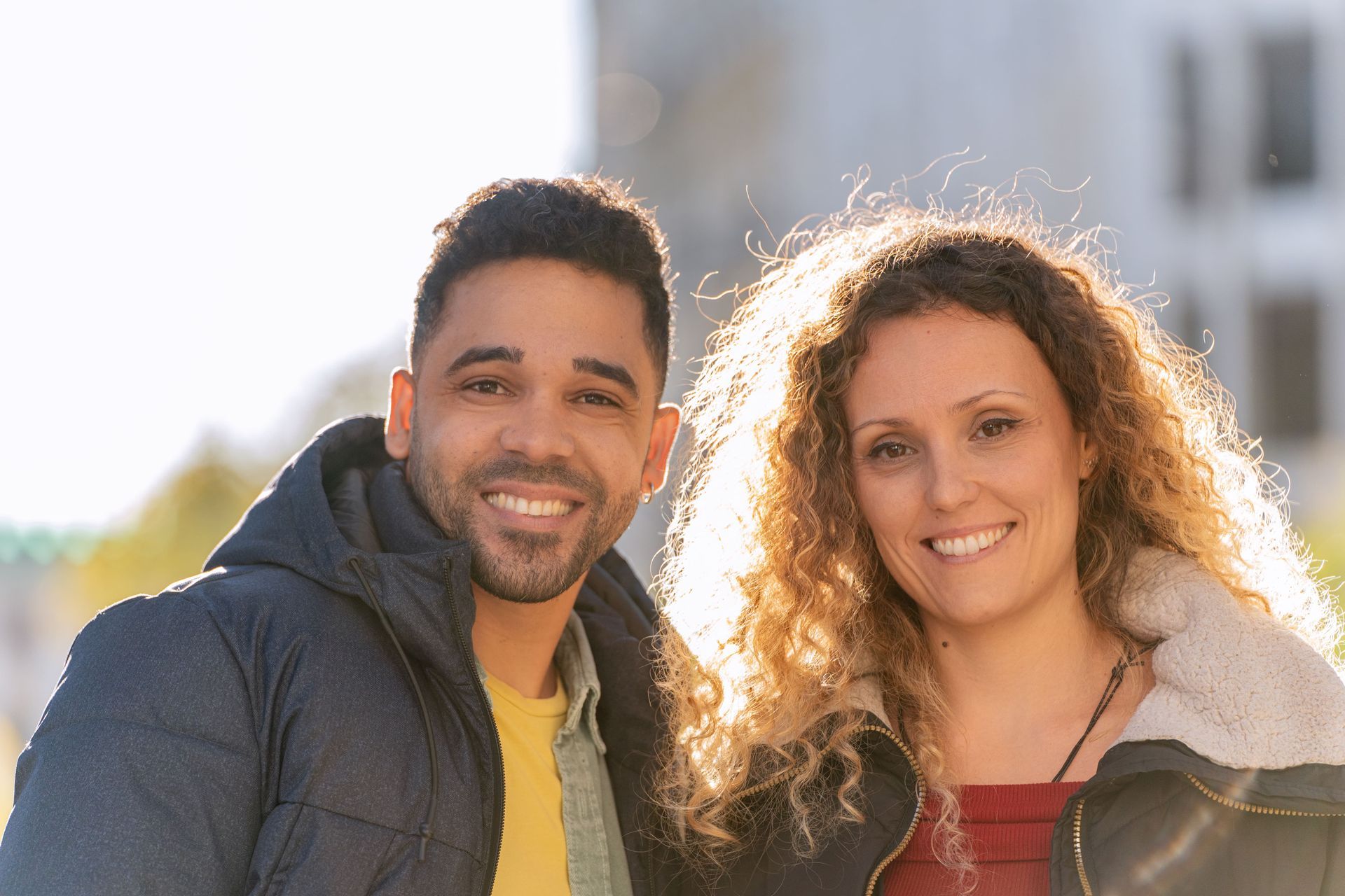 A woman is sitting on a couch with her legs crossed.