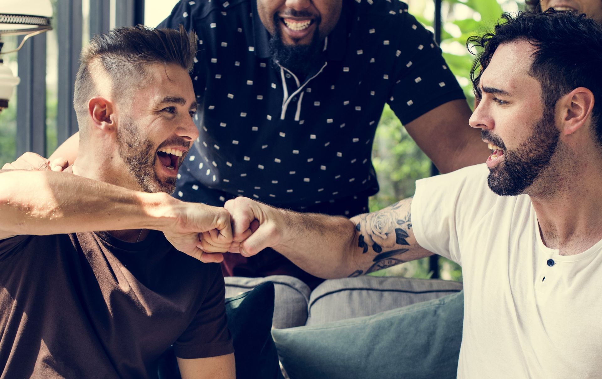 A woman is sitting on a couch with her legs crossed.