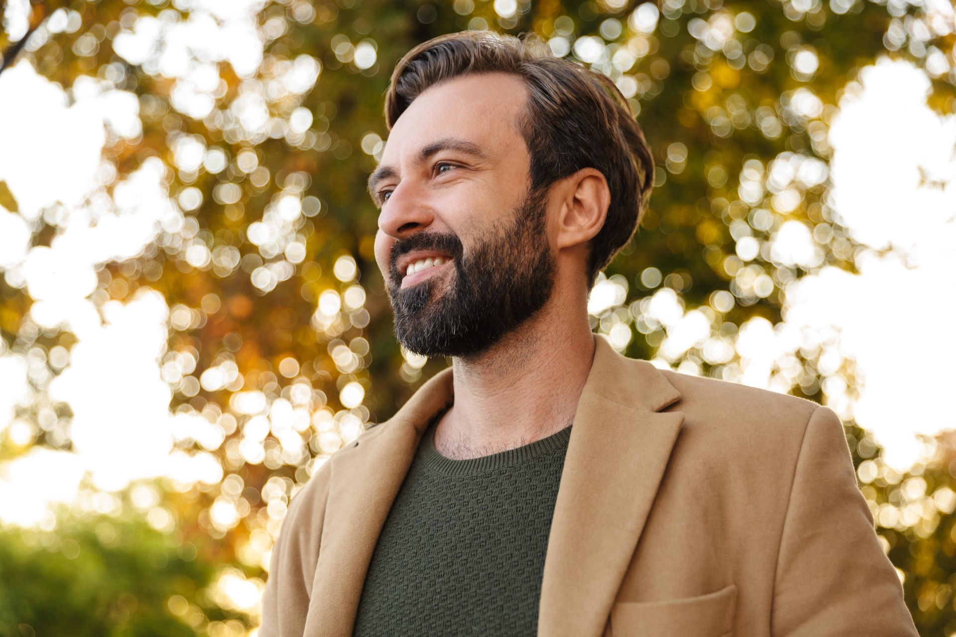 A woman is sitting on a couch with her legs crossed.