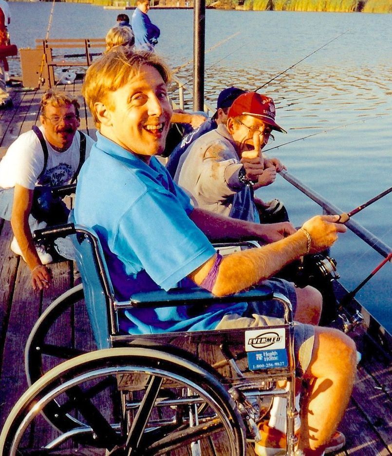 A woman holding a sign that says indians are red