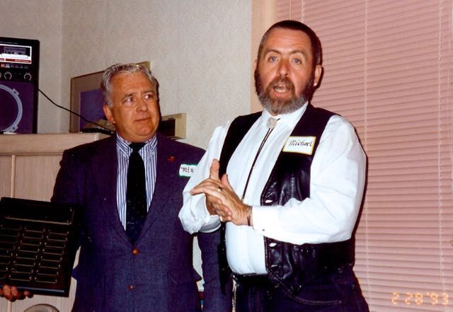 A black and white photo of a teepee in front of the capitol building