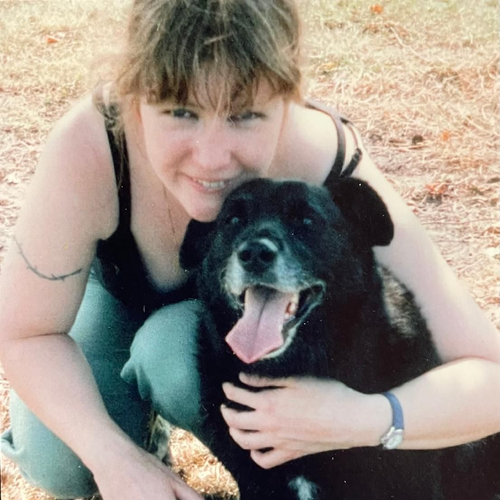 Kate, a member of the Charli's Pet Angels team with a dog