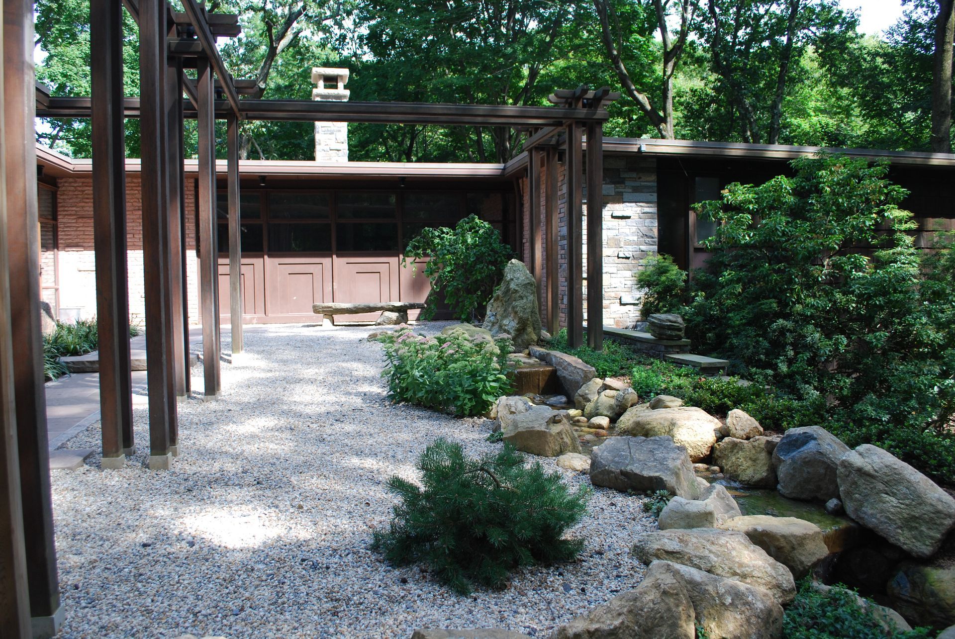 A house with a lot of rocks in front of it