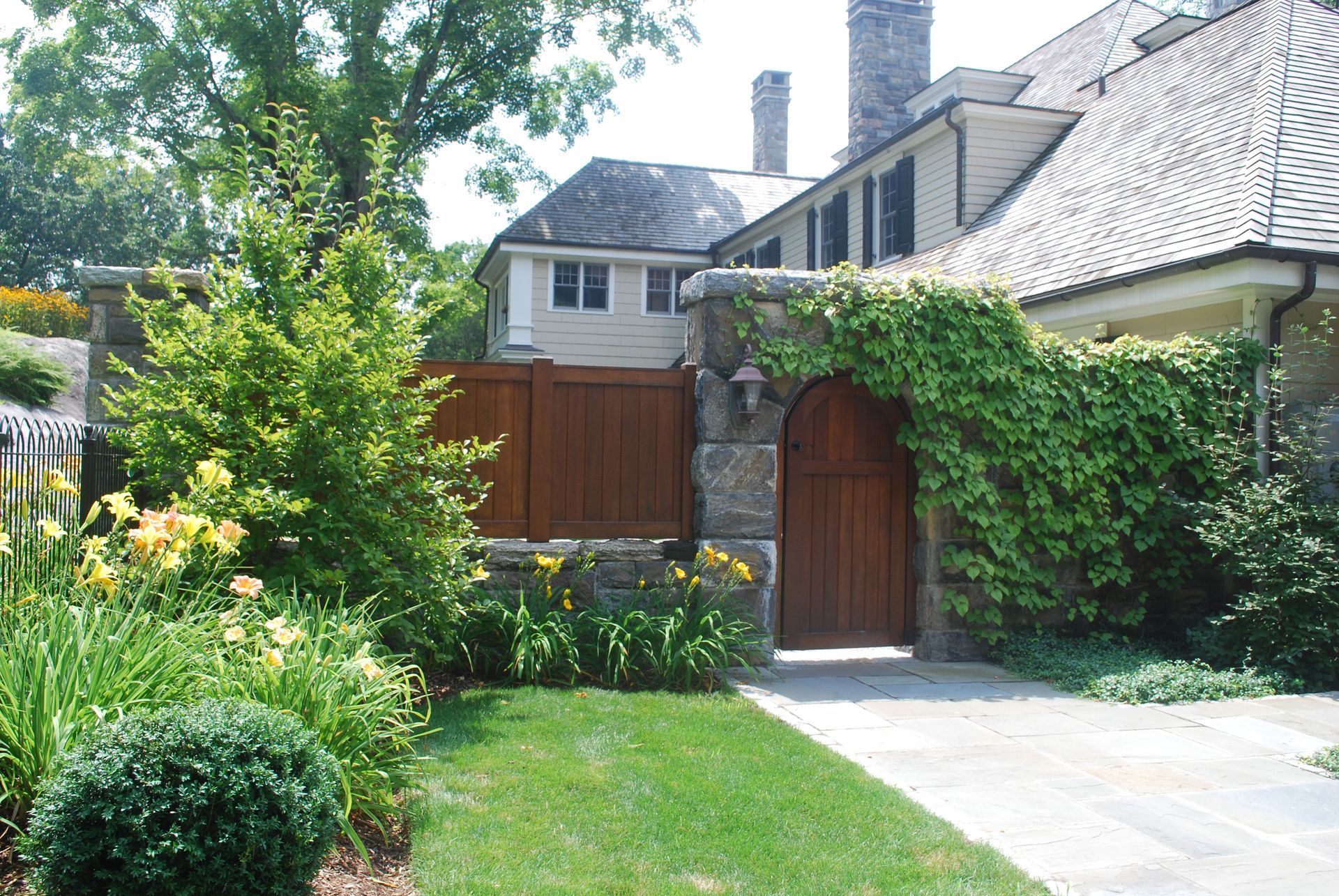 A house with a wooden gate in front of it